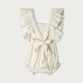 Load image into Gallery viewer, White ruffled organic cotton romper on a white background
